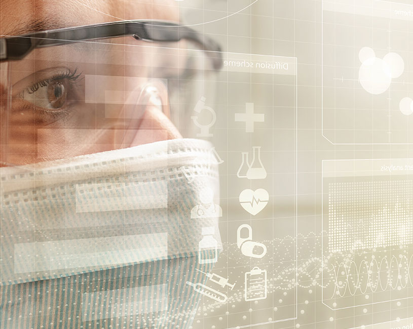 lab professional wearing goggles and a mask